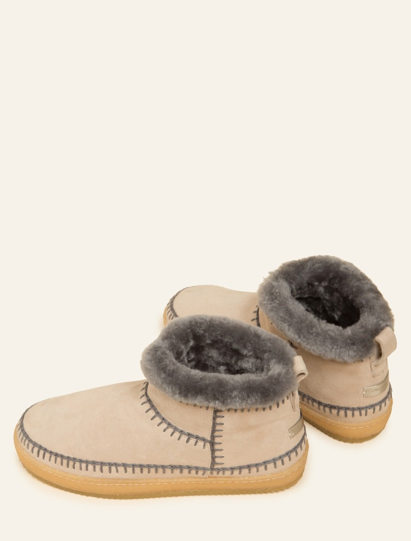 Handmade lace-up sand ankle boots with grey crochet detailing.