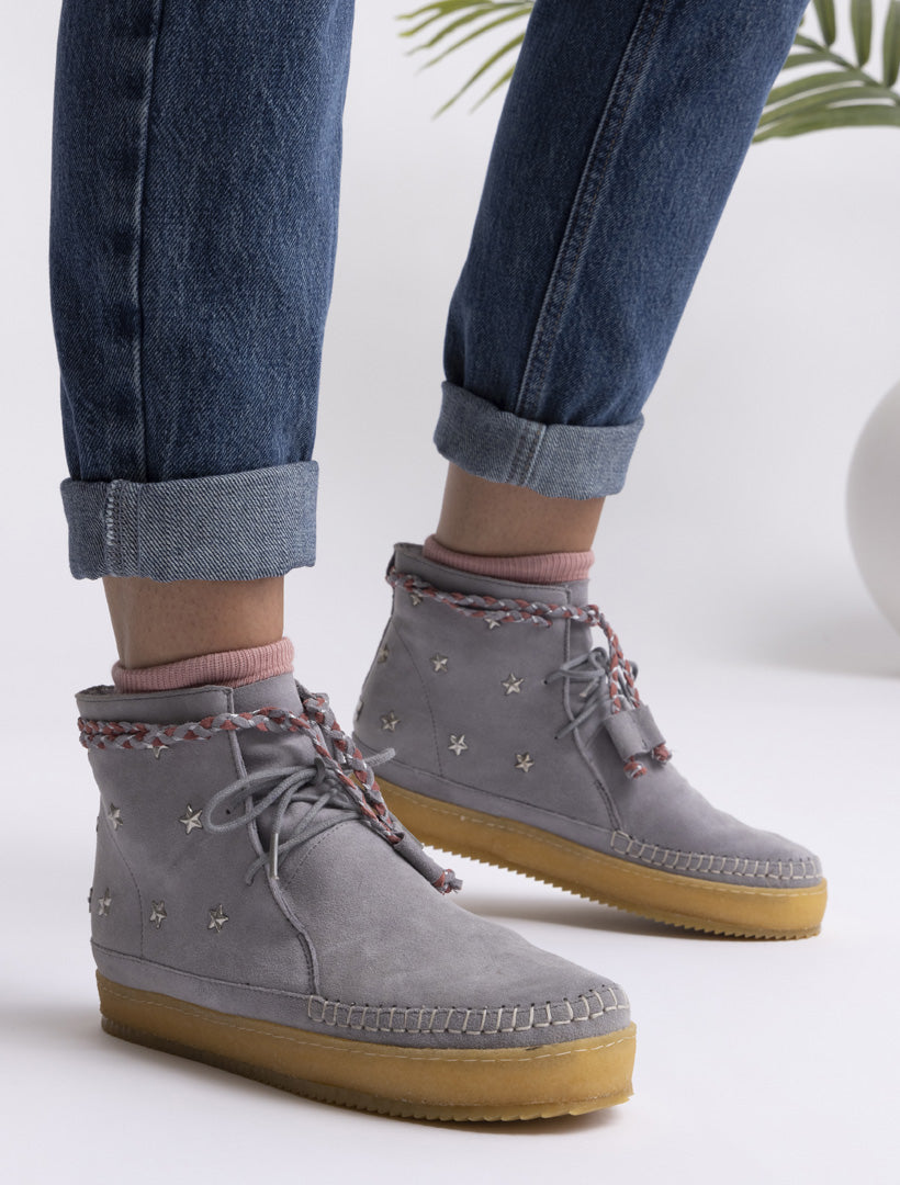 Handmade lace-up stone suede ankle boots with stars studs detailing.