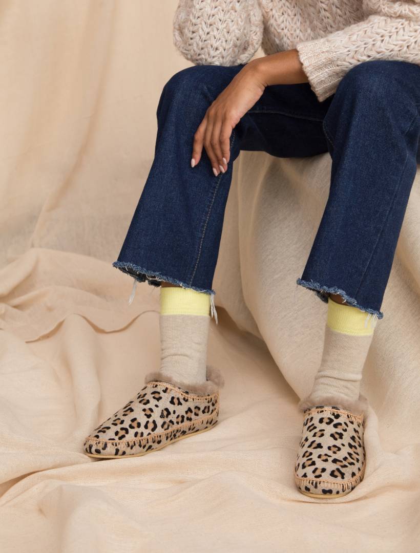 Slip on leopard slipper boots with beige crochet detailing.