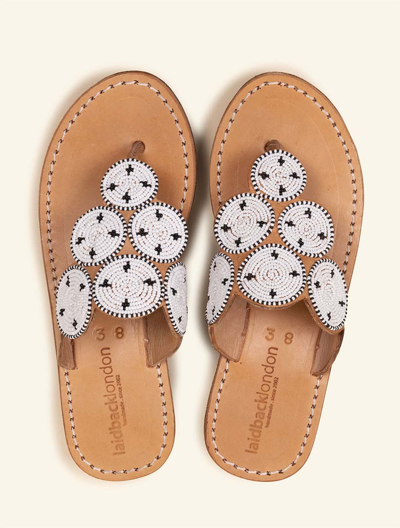 Wedge slide sandal with white maasai beaded detailing.