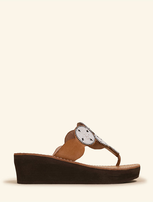 Wedge slide sandal with white maasai beaded detailing.