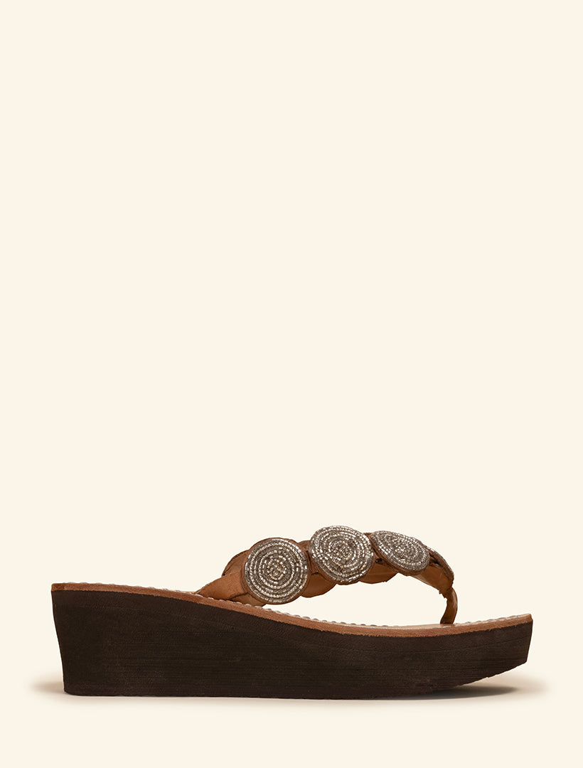 Wedge slide sandal with silver beaded detailing.