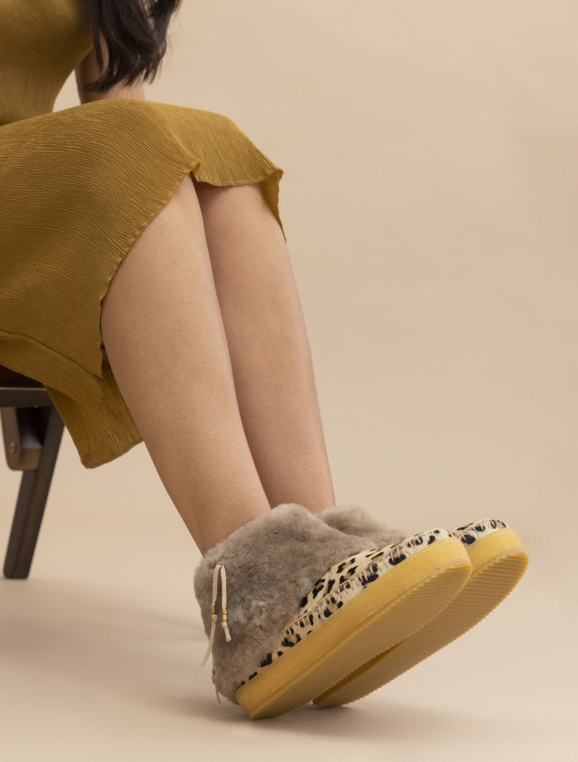 Exposed sheep wool ankle boot feature our classic leopard print with beige crochet detailing.